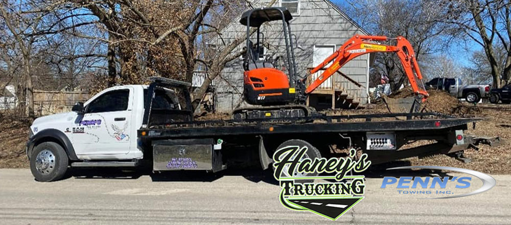 Equipment Hauling done by Haney's Trucking and Tow Service offering Construction and Heavy Equipment Hauling and Towing throughout Kansas City Missouri Metro Area