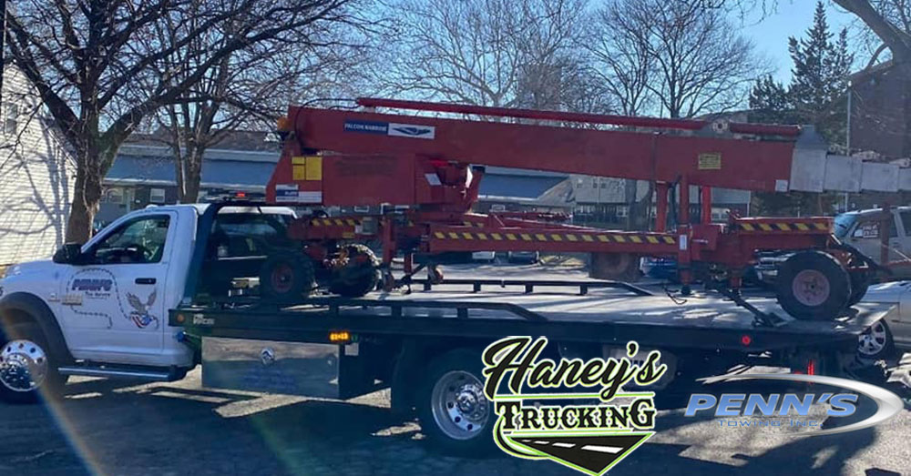 Equipment Hauling done by Haney's Trucking and Tow Service offering Construction and Heavy Equipment Hauling and Towing throughout Kansas City Missouri Metro Area