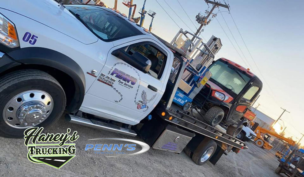 Equipment Hauling done by Haney's Trucking and Tow Service offering Construction and Heavy Equipment Hauling and Towing throughout Kansas City Missouri Metro Area