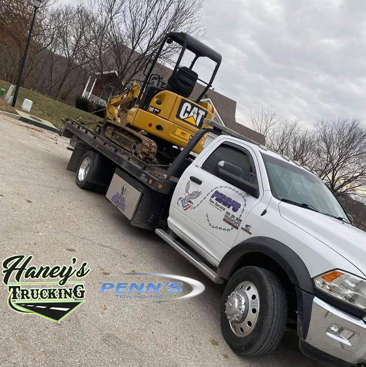 Equipment Hauling done by Haney's Trucking and Tow Service offering Construction and Heavy Equipment Hauling and Towing throughout Kansas City Missouri Metro Area