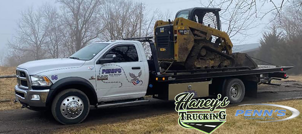 Equipment Hauling for Haney's Trucking and Tow Service offering Construction and Heavy Equipment Hauling Services throughout the Kansas City Missouri Metro Area